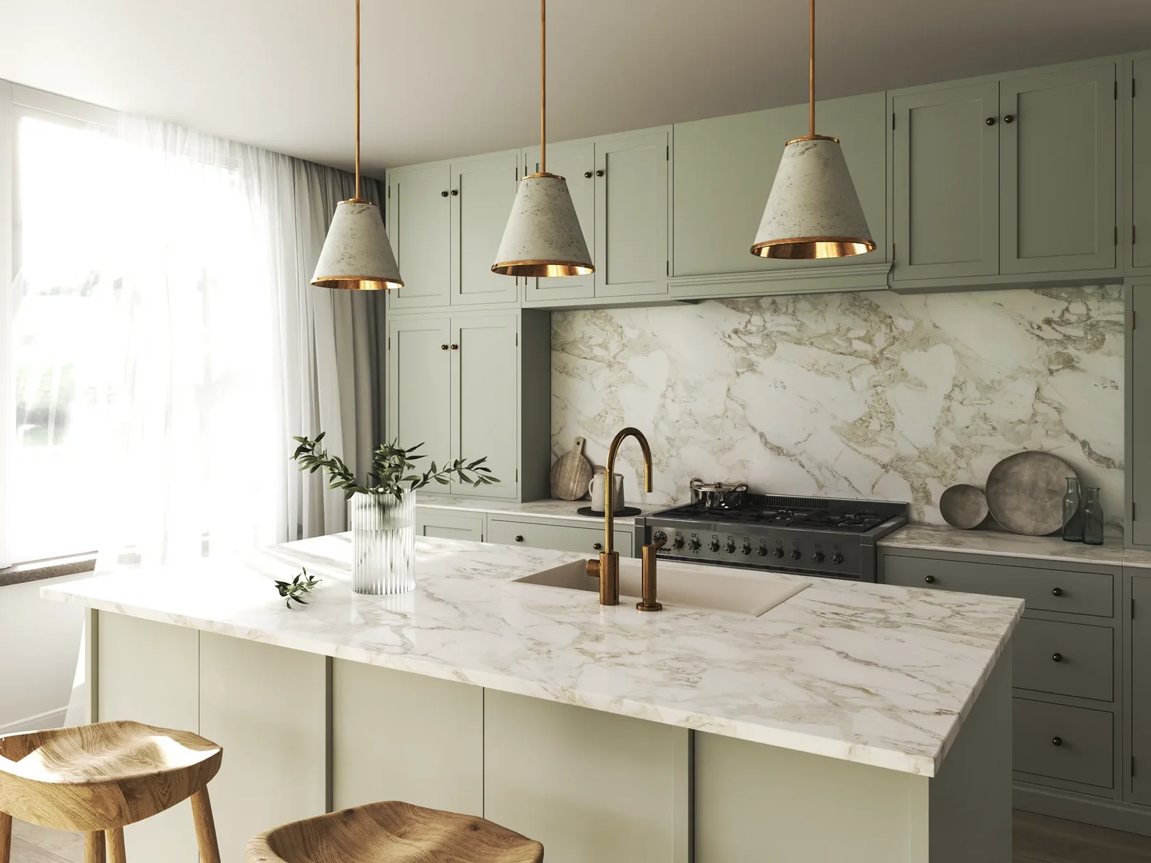 Modern kitchen with sage green cabinets, marble countertops and backsplash, three pendant lights, and black gas range.