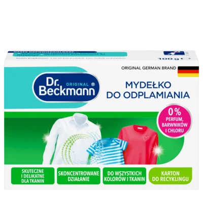 Mydełko do odplamiania – Białe prostokątne pudełko z turkusowymi i zielonymi sekcjami, wyświetlające trzy kolorowe ubrania i okrągłą odznaką.