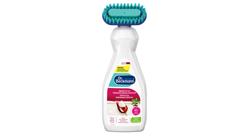 Dr.&nbsp;Beckmann stain remover bottle with turquoise brush head on white plastic container against black background.