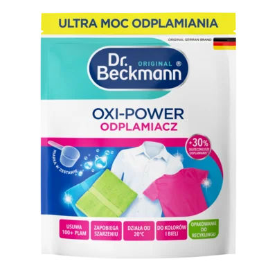 Oxi-Power odplamiacz – Biała saszetka z turkusowymi i niebieskimi elementami, wyświetlająca ściereczkę czyszczącą i kolorowe ubrania.